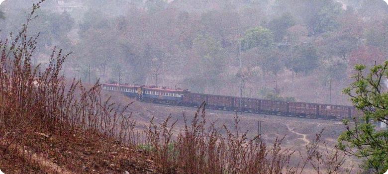 Train vanishing round the bend at Manoharpur